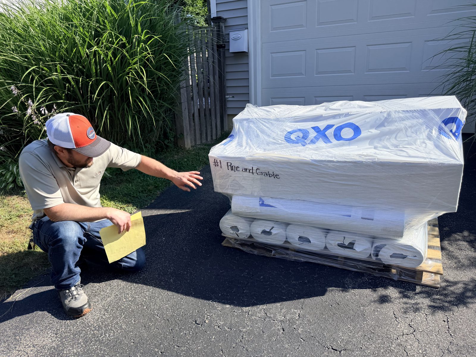 Pallets of IKO shingle bundles delivered to the driveway