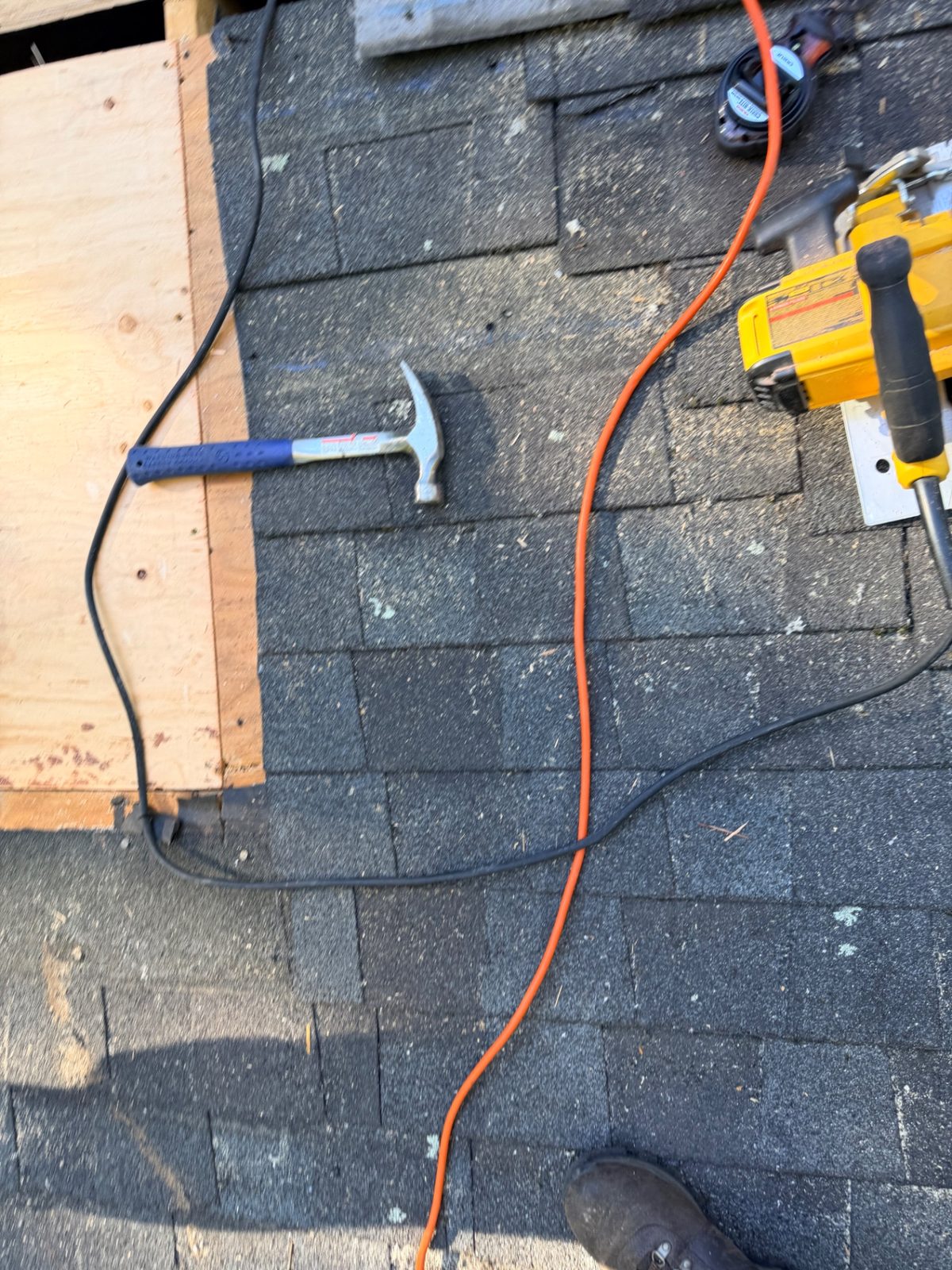 Tools on the Yarmouth roof as shingles go back over the repaired section