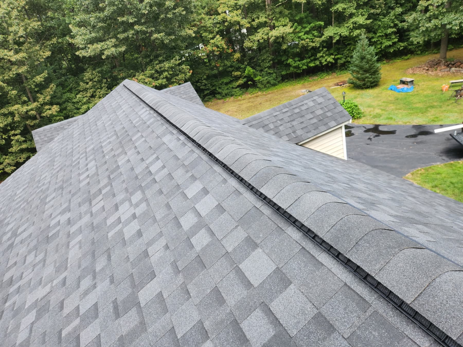 View along the new ridge of the Wells roof with fresh ridge cap shingles
