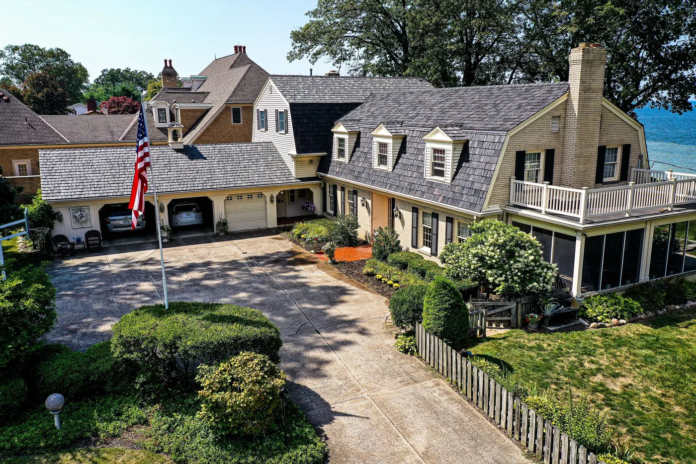 Traditional coastal estate with a gray Brava Old World Slate roof