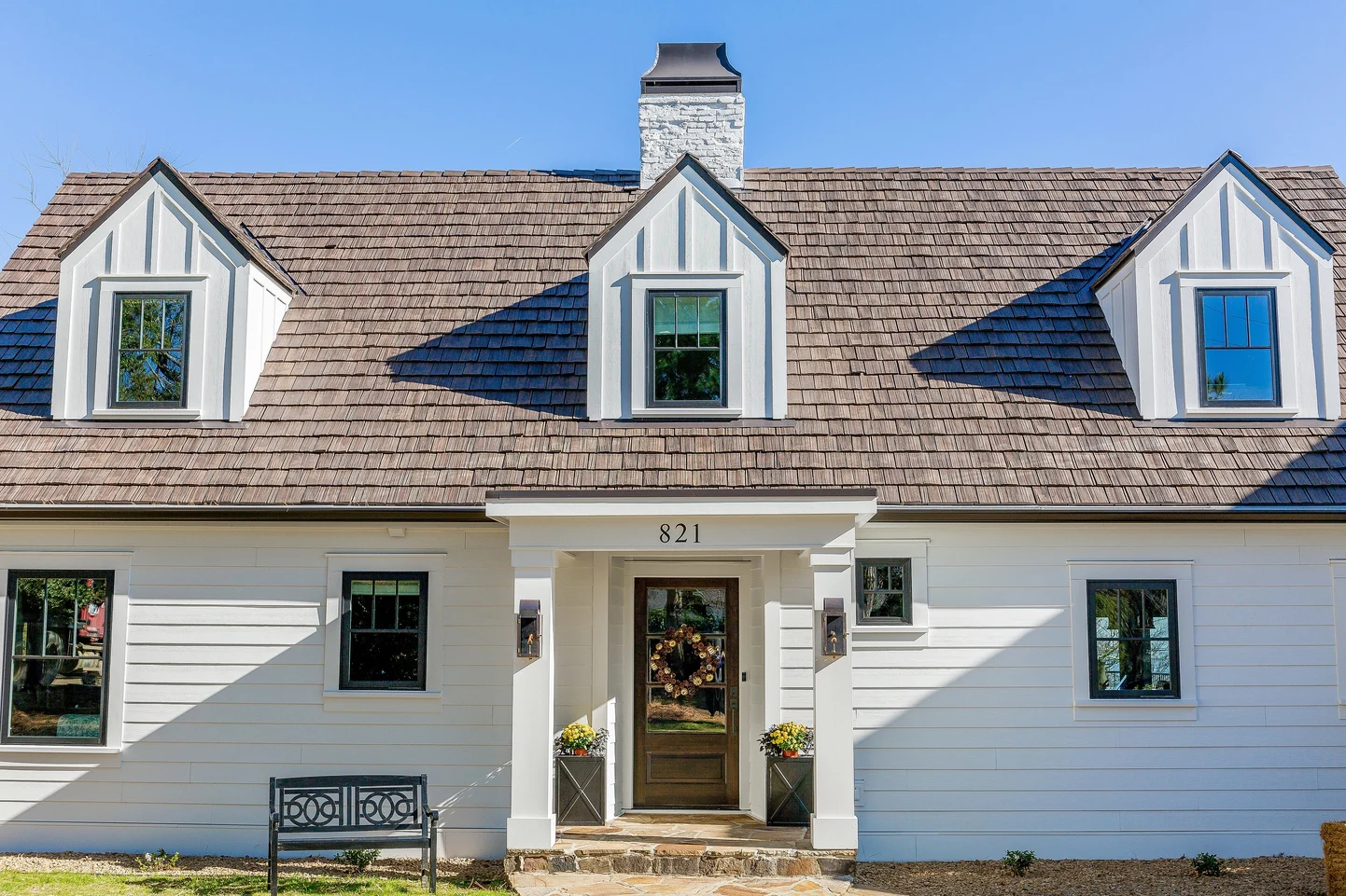 Coastal Maine home featuring composite shake roofing with deep shadow lines