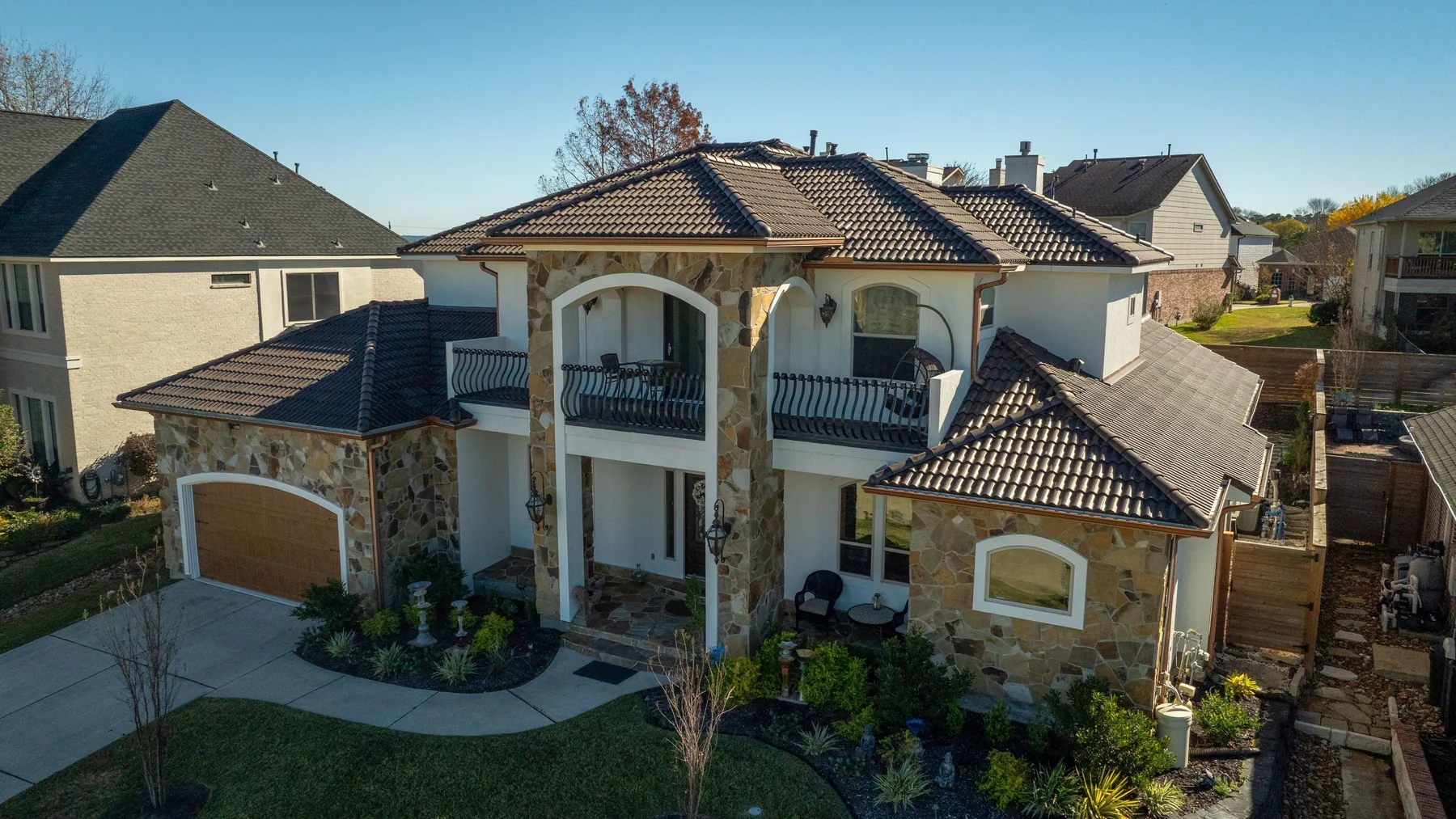 Residence with a warm terracotta Spanish barrel-tile roof