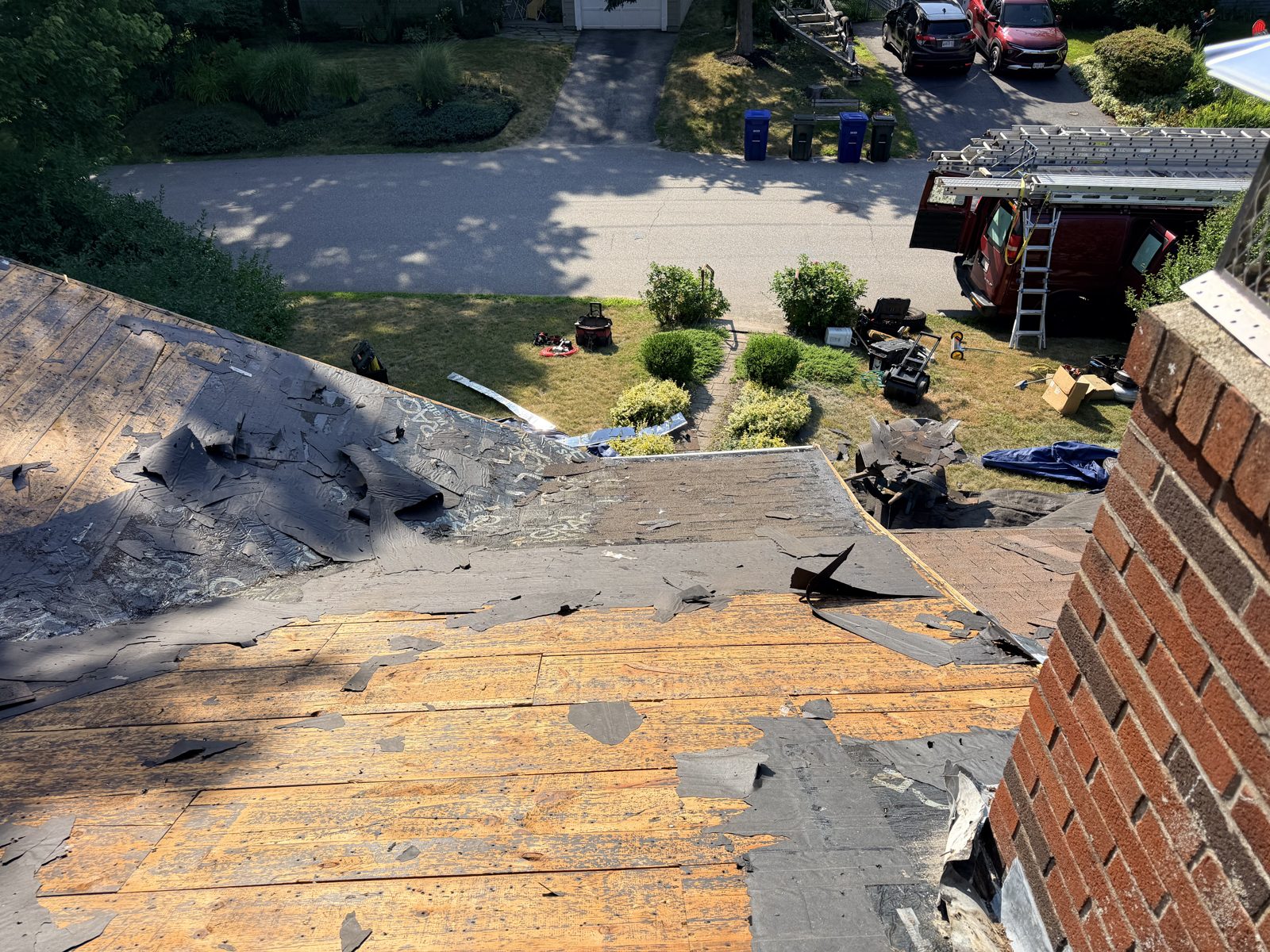 Roof stripped to bare plank sheathing