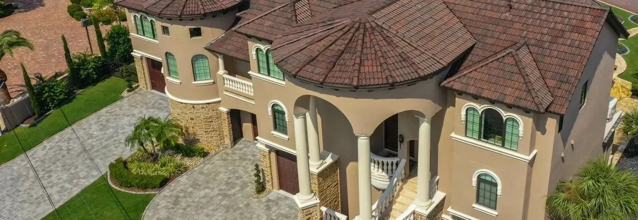 Close architectural view of a blended brown Brava Spanish Barrel Tile roof
